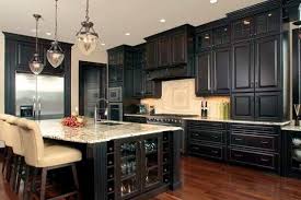 Kitchen Dark Cabinets And Wood Floors Upper Cabinets With Glass Doors Pendant Lights Love Black Kitchen Cabinets Dark Kitchen Dark Kitchen Cabinets