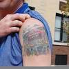 Boxer gloves sports tattoo on bicep. 1
