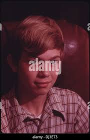 MICHAEL GIPSON, 14, SON OF MR. AND MRS. WAYNE GIPSON WHO LIVE NEAR GRUETLI,  TENNESSEE, NEAR CHATTANOOGA, FEEDS THE FAMILY COWS AFTER SCHOOL. THE FATHER  KEEPS THEM AS WELL AS SOME PIGS