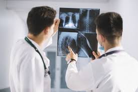 Download Doctors Watching X Ray Shot For Free In 2020 Life And Health Insurance World Health Day Chiropractic Clinic
