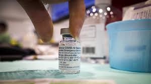 A coronavirus vaccination with pfizer's shot in toronto, canada. Mixing Covid 19 Vaccines Safe But Effect On Immunity Not Yet Clear U K Study