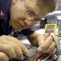 Aviation Ordnanceman Airman Austin Otto performs maintenance