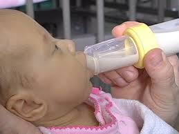A stack of warm towels, a soft wash cloth, cotton balls, gentle cleanser, a cup for rinsing, a container of warm rinse water, and a soft brush designed for babies (for cradle cap, if present). Preemies In The Nicu How Parents Can Help Video Babycenter