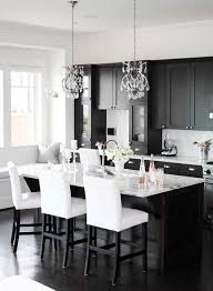 White tiles, dark kitchen island, and red accessories that pop out. 34 Timelessly Elegant Black And White Kitchens Digsdigs