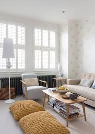 15 Ways To Add Extra Seating In Your Living Room Floor Cushions Living Room Floor Pillows Living Room Small Living Rooms