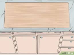 Many people bought a new granite top only to later realize just how ugly the old cabinets now looked. 3 Ways To Remove Kitchen Cabinets Wikihow