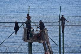 Tv channel 24h reported on tuesday morning that as many as 85 migrants climbed the border fence to break into melilla, which is located about 300km east of ceuta. Mass Arrivals Of Migrants Into Spain S Ceuta Greece S Lesbos Island Arab News