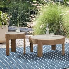 This cocktail table features an engineered wood top that sports a gray driftwood finish for a rustic touch. Portside Outdoor Round Concrete Side Table Coffee Table Set