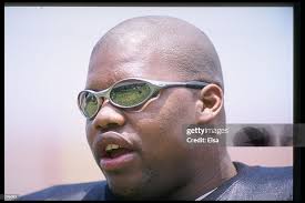 Darrell Russell of the Oakland Raiders relaxes during a practice for...  News Photo