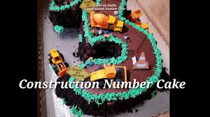 Top your cake with colored candies and wrap it with chocolate. Construction Number Cake Youtube