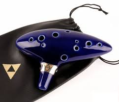 Legend Of Zelda Ocarina Of Time Replica 12 Hole Ocarina With 2 Songbooks And Black Triforce Bag It got messed up somehow during shooting.