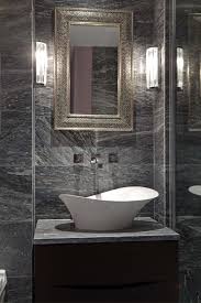 The natural stone countertop is just a little grayer than the white vanity, which makes a nice transition between the tile wall and the rest of the space. Dark Grey Marble Tiles Bathroom Novocom Top