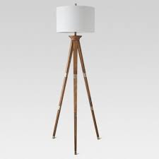 The clean lines in this floor lamp are attractive and simple. Oak Wood Tripod Floor Lamp Brass Threshold Target
