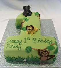 Boy Jungle Themed Birthday Party For 2 Year Old Jungle Themed Number One Cake Jungle Birthday Cakes Boy Birthday Cake First Birthday Cakes