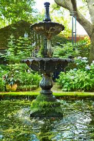 This Charming Charleston Garden Thrives Season After Season In 2020 Charleston Gardens Landscaping With Fountains Garden Fountain