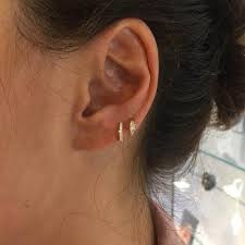18 cool ways to get just your earlobes pierced in 2021 princess diamond ring diamond piercing