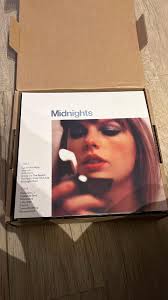 I had a great christmas!! (Swiftmas) And i got the eras tour book, eras  socks (not photographed) , a new record player,the anthology CD, and a  swiftie beanie!! Merry swiftmas everyone!! 🫶🏻🫶🏻