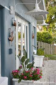 Clean surfaces before hanging outdoor wall decor if you are using a product that sticks to the wall. How To Hang Outdoor Wall Decor Without Nails H2obungalow