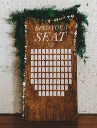 Picture Of A Wooden Board With A Geometric Seating Chart A