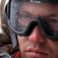 U.S. Navy Boatswain's Mate 1st Class Dmitry Spiridonov, left, acts as the  flight deck safety officer and Boatswain's Mate 3rd Class Guanqun Sun acts  as the landing signalman enlisted during the launch