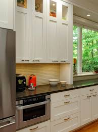 It will look wonderful paired with the contrasting white cabinets. White Galley Kitchen With Black Quartz Countertop Hgtv
