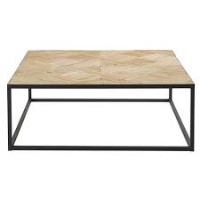 Constructed from reclaimed elm wood, this cocktail table features natural wood grain and rustic texture with a geometric, triangle base. Black Metal And Recycled Elm Inlaid Coffee Table Camus Maisons Du Monde