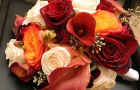 King protea serves as the centerpiece, while bordeaux anemones, sharry baby orchids, campanella peach garden roses, italian ruscus, and acacia fill out the rest of this eclectic fall wedding arrangement by branch design studio. Fall Wedding Bouquet Ideas Lovetoknow