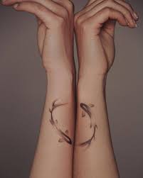 You can get any pisces tattoo that you want to show that you are an unselfish lover. Koi Fishes Pisces Sign Tattoo On The Forearm