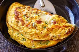 This Ham And Cheese Omelet Recipe Is Made With Holiday Leftovers Cheddar Mustard And Parsl Ham And Cheese Omelette Omelette Recipe Easy Leftover Ham Recipes