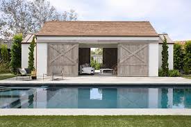 Modern pool house addition in park city, utah. A Contemporary House In California Was Designed With Farmhouse Elements Throughout Modern Pool House Pool House Designs Modern Pools
