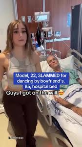 A 22-year-old model has been slammed for dancing gleefully by her elderly  boyfriends hospital bed after being named in his will. Bronwin Auroras  video is believed to be a joke, as her