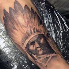 This is a heavily detailed tattoo of a native american woman wearing face marks or her tribe, a head piece and some feathers. 100 Native American Tattoos For Men Ideas 2021 Inspiration Guide