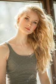 Romantic Blonde. Young Beautiful Cute Woman. Beauty Girl With Long Shiny  Hair, Glowing Skin And Voluminous Haircut Stock Photo, Picture And Royalty  Free Image. Image 89354904.