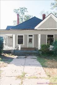 Grey siding black windows white trim. Choosing The Perfect Exterior Paint Colors For Our Farmhouse Bungalow Flip Renovation