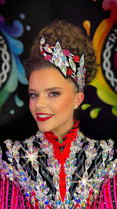 Bonnie Moriarty @tolanflanaganacademy glowing in this fresh,  pearl-and-crystal Rising Star creation. A clean white base, vibrant emerald  detailing and striking structure make this look beautifully bold