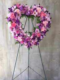 Purple frame with purple tulips over white. Purple And Lavender Heart Funeral Flowers In Houston Tx The Orchid Florist