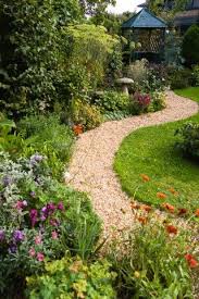English Cottage Garden Winding Shingle Path Leading To A Gazebo Between Grass Lawn And Flowerbed Of English Cottage Garden Cottage Garden Garden Design