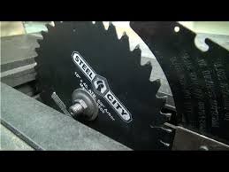 Insert the screwdriver at the blade hole. How To Change A Table Saw Blade Youtube