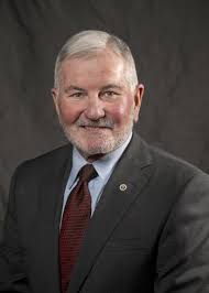 Trustee Gregory A. White