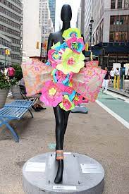 After you watch this video, you will be able to amaze your friends by making flowers glow in the dark! Sidewalk Catwalk Slideshow 32 Big Name Designers Turn Mannequins Into Art Mannequin Art Neon Flowers Flower Power Dress