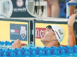 Adrian leads way into 100m free semis as Phelps sits out session