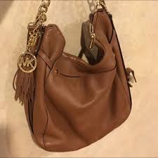 Made of pebbled, colorblocked leather and gold hardware. Trade Michael Kors Chain Purse Purses Purses Crossbody Michael Kors