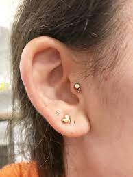 Got My Tragus Pierced With This Beautiful Titanium Anodized To Rose Gold And Opal Piece From The Haute Piercing Retainers Body Jewelry Double Nostril Piercing