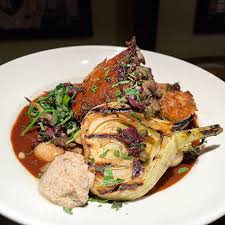 Place the cake tin onto the preheated baking tray . Millennium Restaurant Panko Crusted Maitake Mushroom Chestnut Farro Risotto Cake Red Wine Caramelized Onion Reduction Truffle Butter Seared Oyster Mushrooms Turnip Spinach Gigante Beans Black Olive Herb Oil Grilled