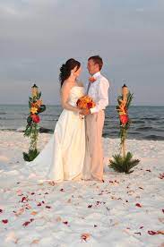 Affordable Beach Wedding Packages With Decorated Tiki Torches For Any Budget Budget Beach Wedding Wedding Beach Ceremony Beach Wedding Arch