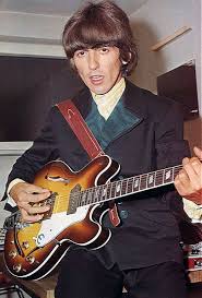 George Harrison With His Epiphone Casino Guitar The Beatles Beatles George George Harrison