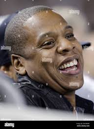 Entertainer Shawn "Jay-Z" Carter watches Game 3 of baseball's American  League Championship Series between the Texas Rangers and New York Yankees  Monday, Oct. 18, 2010, in New York. (AP Photo/Kathy Willens Stock