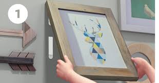 If you are using picture hanging strips, make a mark. How To Use Command Strips For Hanging Pictures