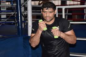Indian boxer satish kumar (+91kg) eased into the quarterfinals of his debut olympic games, defeating jamaica's ricardo brown in his opening bout here on thursday. Coronavirus Outbreak Tokyo Olympics 2020 Bound Boxer Satish Kumar Using Tyres And Ropes To Keep Fit During Lockdown Sports News Firstpost