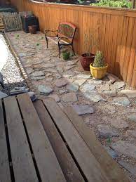 A french drain or a drain tile is built by filling a trench with gravel and a perforated pipe is used at the bottom to divert underground water. We Did It Stepping Stones With Pea Gravel And Creeping Thyme Laid Over A French Drain Outdoor Decor Patio French Drain